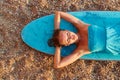 Surfing sport, summer time, time to relax and desire of adventure idea. Cute lady with wet hair on rest on surfboard.