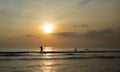 Surfing in the sunset at Kuta Beach, Bali-Indonesia Royalty Free Stock Photo