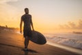 Surfing. Surfer Carrying Surfboard On Ocean Beach.