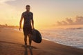 Surfing. Surfer With Surfboard Walking On Ocean Beach At Beautiful Sunrise In Bali. Royalty Free Stock Photo