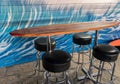 Surf board bar and stools Royalty Free Stock Photo