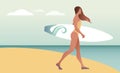 Surfing Time. Young woman in swimsuit carrying a surfboard on the beach