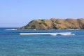 Surfing waves at Kuta beach, Lombok, Indonesia