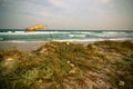 Surfing wind-sock on empty sea beach during storm