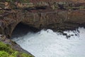 Surging billow in huge basin Australian rocky coast Royalty Free Stock Photo