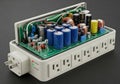 Surge protector with internal components exposed, including capacitors, inductors, resistors, and Royalty Free Stock Photo