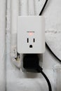 Surge protector power outlet glows red and indicates that it is protected