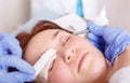 Surgeon applies a bandage to the female patient`s eyelids after Royalty Free Stock Photo