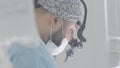 Surgeon with binocular glasses on operation. Action. Modern technologies in medicine and surgeons. Glasses with Royalty Free Stock Photo