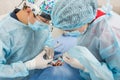 Surgeon Dentist with assistant making professional Using a needle for anesthesia patient at the dental office.The pain and sufferi