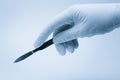 Surgeon hand with scalpel Royalty Free Stock Photo