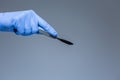 Surgeon hand with a scalpel Royalty Free Stock Photo