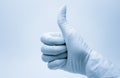 Surgeon hand with thumb up