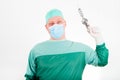 Surgeon holding antique, old fashioned medical drill