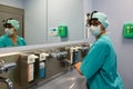 Surgeon in hospital washing thorouughly his hands before performing a surgery. Royalty Free Stock Photo