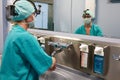 Surgeon in hospital washing thorouughly his hands before performing a surgery. Royalty Free Stock Photo