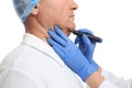 Surgeon with marker preparing man for operation against background, closeup. Double chin removal Royalty Free Stock Photo