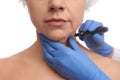 Surgeon with marker preparing woman for operation against white background. Double chin removal Royalty Free Stock Photo