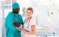 Surgeon and nurse conversing in hospital Royalty Free Stock Photo