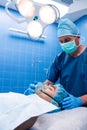 Surgeon placing an oxygen mask on the face of a patient Royalty Free Stock Photo