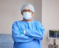 Surgeon, portrait and man with arms crossed in hospital with confidence in emergency healthcare, medicine or cardiology Royalty Free Stock Photo