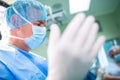 Surgeon preparing for operation in operation room Royalty Free Stock Photo