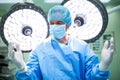 Surgeon preparing for operation in operation room Royalty Free Stock Photo