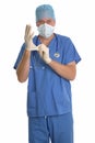 Surgeon putting gloves on. Royalty Free Stock Photo