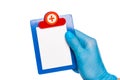 Surgeon`s hand in a blue medical glove holds a mock up plate Isolated on a white background. dentistry