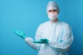 Surgeon in sterile blue uniform, medical gloves and mask Royalty Free Stock Photo