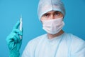 Surgeon in sterile blue uniform, medical gloves and mask Royalty Free Stock Photo