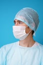 Surgeon in sterile blue uniform, medical gloves and mask Royalty Free Stock Photo