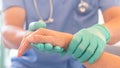 Surgeon, surgical doctor, anesthetist or anesthesiologist holding patient`s hand for health care trust and support in professional