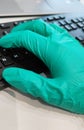 Surgeon surgical doctor on hygiene protective disinfection green glove typing keyboard, Researching and analysing in hospital labo