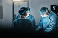 Surgeon team, people and operating room at hospital in scrubs, ppe and help for emergency healthcare procedure. Doctors Royalty Free Stock Photo