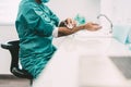 Surgeon washing hands before operating patient in hospital - Medical worker getting ready for fighting against corona virus Royalty Free Stock Photo