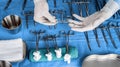 Surgeon working in operating room, hands with gloves holding scissors sutures