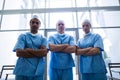 Surgeons with arms crossed standing in hospital corridor Royalty Free Stock Photo