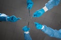 Surgeons Hands Holding Medical Instruments