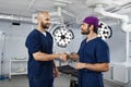 Surgeons Handshake in Operating Room Royalty Free Stock Photo