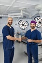 Surgeons Handshake in Operating Room Royalty Free Stock Photo