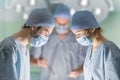 Surgeons during operating in surgery room Royalty Free Stock Photo