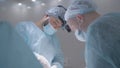 Surgeons perform difficult operation. Action. Two surgeons are concentrating on performing complex operation under Royalty Free Stock Photo