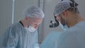 Surgeons perform difficult operation. Action. Two surgeons are concentrating on performing complex operation under Royalty Free Stock Photo