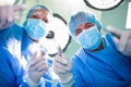 Surgeons performing operation in operation room Royalty Free Stock Photo