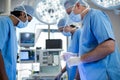 Surgeons performing operation in operation room Royalty Free Stock Photo