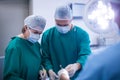 Surgeons performing operation in operation room Royalty Free Stock Photo
