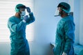 Surgeons preparing for surgical operation during coronavirus outbreak - Focus on right doctor head