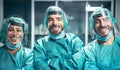 Surgeons smiling after a successful surgical operation - Medical workers the real heroes during corona virus outbreak Royalty Free Stock Photo