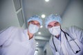 Surgeons standing above of the patient before surgery Royalty Free Stock Photo